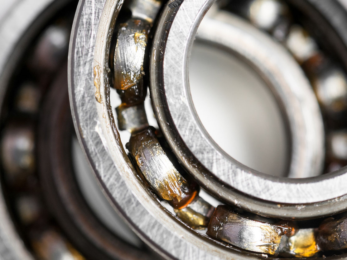 Closeup of a pair of bearing used in motor for home appliances. Top view on a white background.